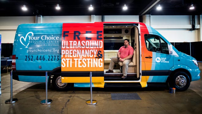 A van offering free pregnancy testing is parked in the exhibit hall at the Conservative Political Action Conference.