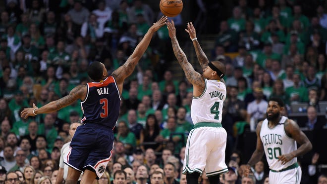 Boston Celtics guard Isaiah Thomas shoots the ball over Washington Wizards guard Bradley Beal during the first half in Game 7.