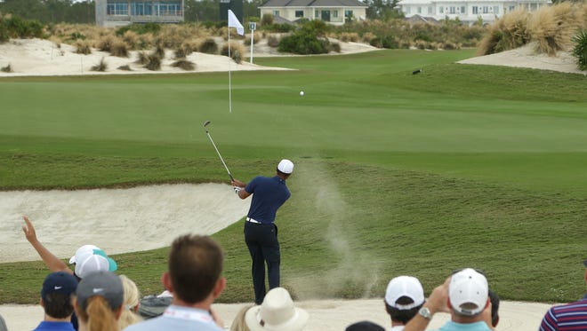 Tiger Wood hits onto the 6th green during Round 2 of the Hero World Challenge.