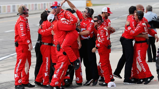 Kyle Larson's crew celebrates his third win of the season, at Michigan International Speedway on Aug. 13.