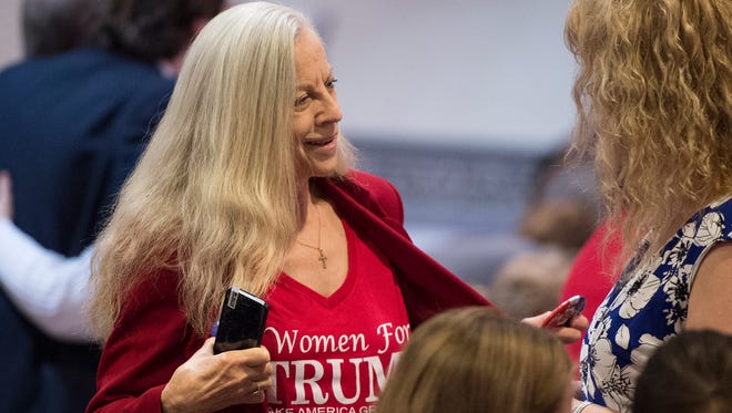 A Trump supporters shows off her "Women for Trump" shirt to a friend inside the Eisenhower Complex in Gettysburg, Pa. on Saturday, Oct. 22, 2016.