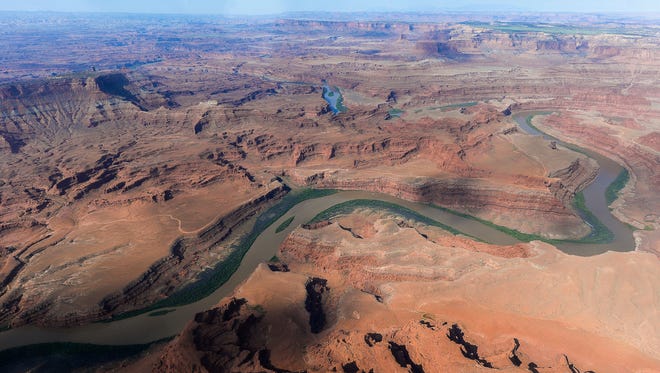 This May 23, 2016, file photo, shows the northernmost boundary of the proposed Bears Ears region, along the Colorado River, in southeastern Utah. Western Democrats are pressuring President Donald Trump not to rescind land protections put in place by President Barack Obama, including Utah's Bears Ears National Monument. Obama infuriated Utah Republicans when he created the monument on 1.3 million acres of land that is sacred to Native Americans.
