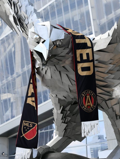 An Atlanta United scarf adorns the falcon statue at Mercedes-Benz Stadium before their game against Orlando City SC.