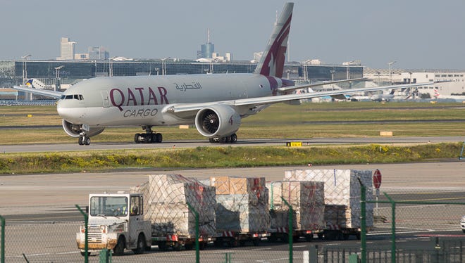 A Qatar Cargo Boeing 777 taxis for takeoff at Frankfurt International Airport in Germany.