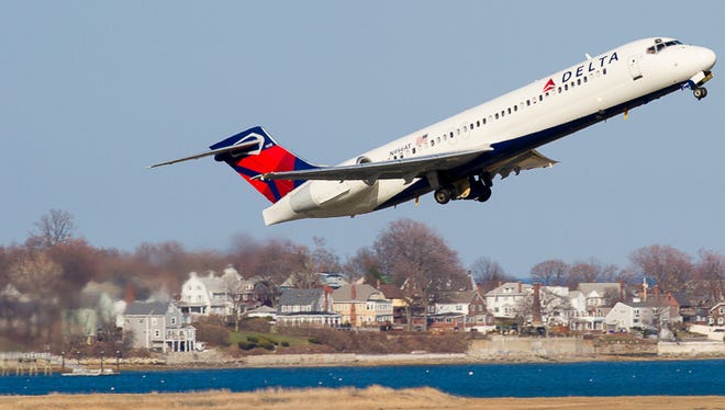 A Delta Boeing 717 rockets out of Boston's Logan Airport on a sunny weekday afternoon.