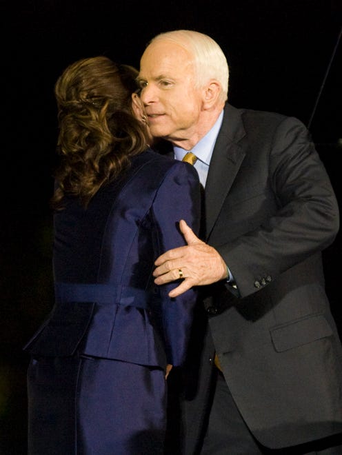 Sen. John McCain hugs Palin after his concession speech in Phoenix on Nov. 4, 2008.