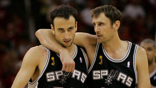 2007: Brent Barry puts his arm around Ginobili late in the fourth quarter of Game 3 of the NBA Finals against the Cleveland Cavaliers.
