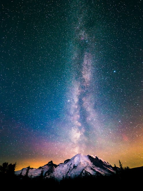 The Milky Way seems to emerge like smoke  over Mount Rainier National Park in Washington on July 15, 2015.