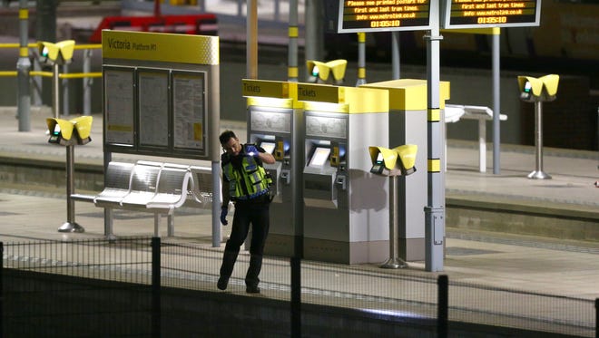 A policeman patrols Victoria Railway Station close to the Manchester Arenain Manchester, England.