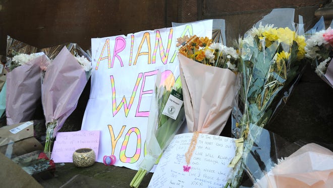 Flower tributes line St Ann's square in Manchester, England, on May 23, 2017.