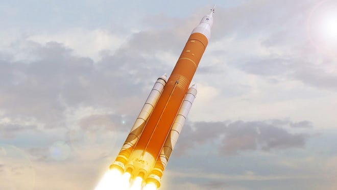 An artist rendering of NASA's Space Launch System launching into the clouds. NASA is studying the costs and risks of flying astronauts in an Orion capsule launching atop the first flight of the Space Launch System rocket.