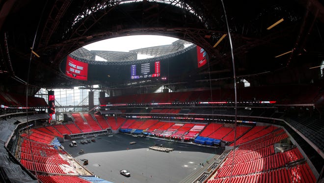 The field is shown during a tour of Mercedes Benz Stadium, the new home of the Atlanta Falcons football team and the Atlanta United soccer team, Tuesday, July 25, 2017, in Atlanta. (AP Photo/John Bazemore) ORG XMIT: GAJB103