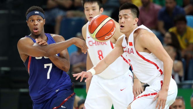 United States guard Kyle Lowry (7) passes the ball against China guard Ran Sui (5) in the men's basketball group A  preliminary round during the Rio 2016 Summer Olympic Games at Carioca Arena 1.
