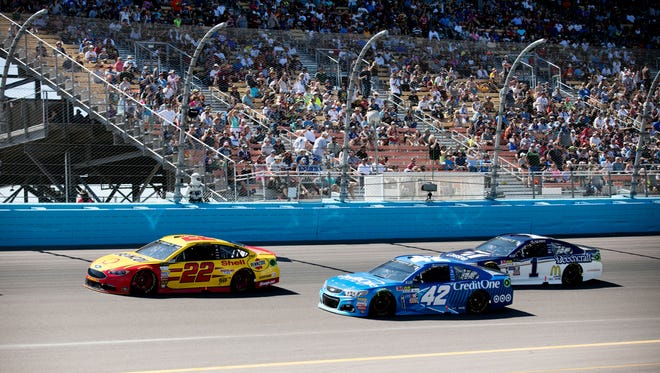 Joey Logano (22), Kyle Larson (42) and Jamie McMurray (1) race during the Camping World 500 at Phoenix International Raceway on March 19. Ryan Newman won.