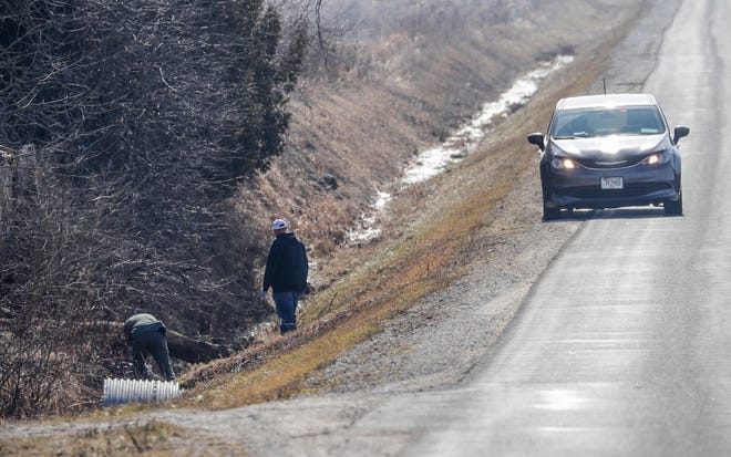 Officials search in a ditch along Johnston Drive near State 310 during the search for missing 3-year-old, Elijah Vue, on Tuesday, Feb. 27, 2024, in Two Rivers, Wis. He was reported missing Feb. 20.