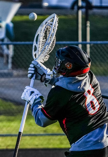 Cedarburg keeper Charlie McGarry (8) makes a save during the lacrosse match at Catholic Memorial on Wednesday, March 20, 2024. Cedarburg won 6-5.