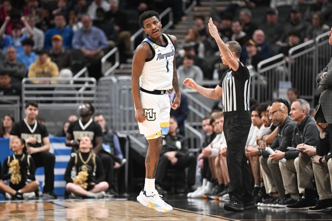 Mar 24, 2024; Indianapolis, IN, USA; Marquette Golden Eagles guard Kam Jones (1) reacts during the first half against the Colorado Buffaloes at Gainbridge FieldHouse. Mandatory Credit: Robert Goddin-USA TODAY Sports