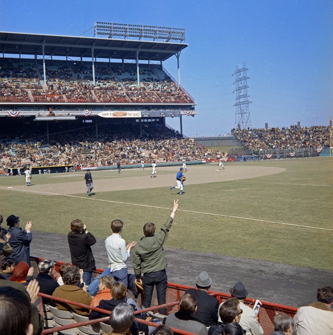 Fans cheer as the Brewers take the field during the Brewers' first opening day on April 7, 1970. The game was also the season opener for the Brewers. A crowd of 37,237 saw the Brewers fall to the California Angels 12-0.