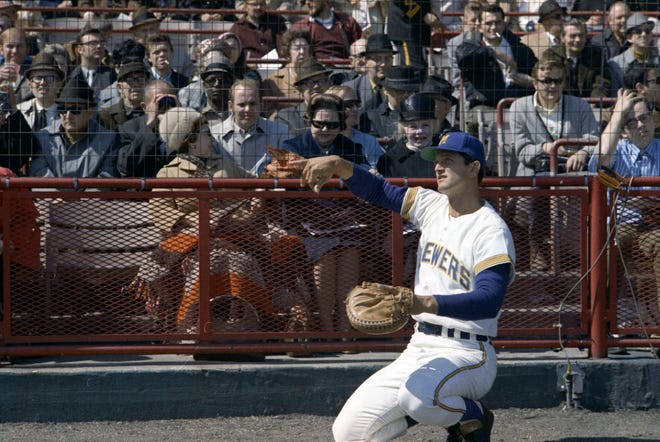 Brewers catcher Jerry McNertney catches the first pitch from Milwaukee County Executive John Doyne during the Brewers' first opening day on April 7, 1970. The game was also the season opener for the Brewers. A crowd of 37,237 saw the Brewers fall to the California Angels 12-0.
