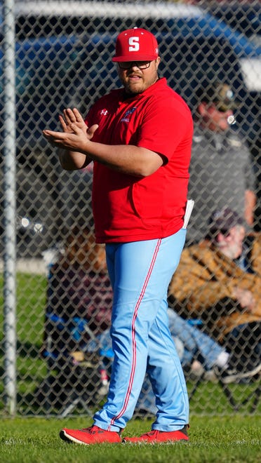 Slinger head coach Brandon Nelson applauds a play during the game at Hartford, Thursday, April 25, 2024. Hartford won 9-6.