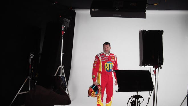 Stewart endures yet another photo shoot, this one in his Nationwide Series suit. "Nice, nice!" shouts a director. "You're a pro. That was bad ass."