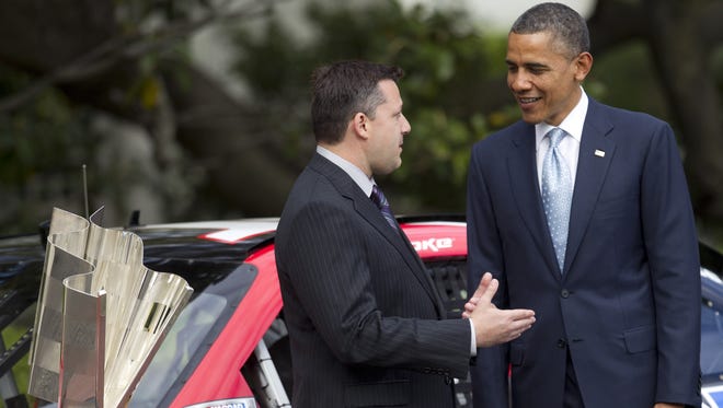 President Barack Obama (right) talks with NASCAR Sprint Cup Series champion Tony Stewart during an event to honor him and the other 2011 Sprint Cup Series drivers at the White House on Tuesday, April 17, 2012.