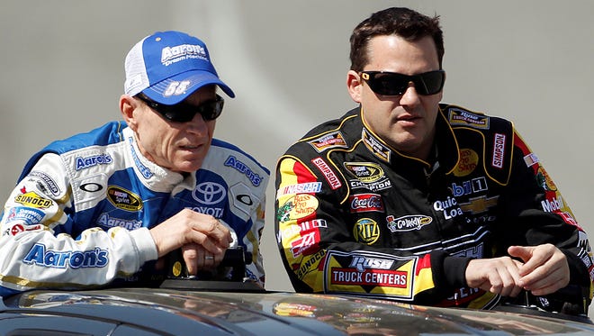 Mark Martin, left, talks to Tony Stewart during the drivers' introductory lap before the Sprint Cup race in Fontana, Calif., in 2013.