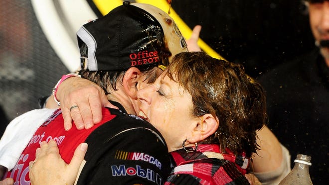 Stewart celebrates his third Sprint Cup title with his mother Pam Boas at Homestead-Miami Speedway in November 2011.
