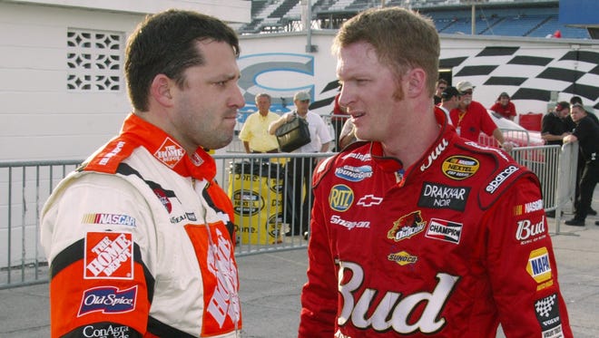 Stewart and Dale Earnhardt Jr. talk after the first session of practice for the Bud Shootout in 2004.