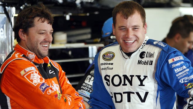 Tony Stewart, left, shown with Ryan Newman in November 2005, said parting ways with his friend at SHR 'was a hard decision. ... I believe in him.'