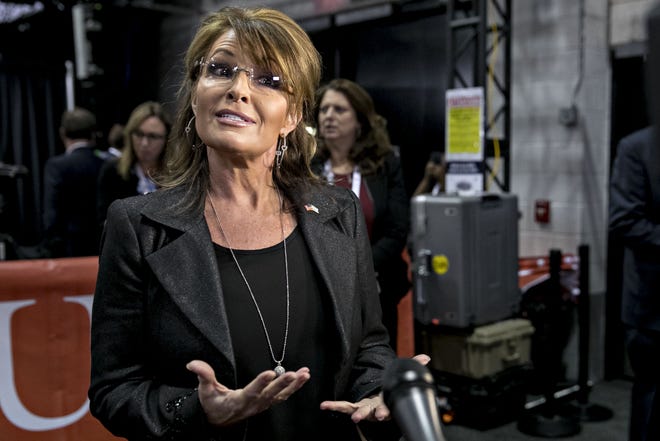 Sarah Palin speaks to members of the media in the spin room after the third U.S. presidential debate in Las Vegas, Nevada, U.S., on Oct. 19, 2016.