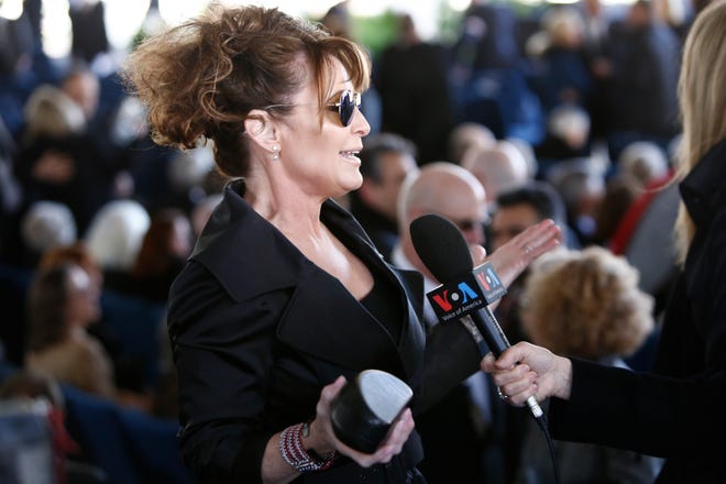 Sarah Palin gives a media interview before the start of a funeral service for Rev. Billy Graham at the Billy Graham Library on March 2, 2018 in Charlotte, N.C.