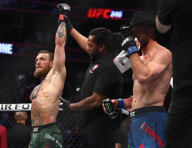 Conor McGregor is declared the winner by TKO against Donald Cerrone at UFC 246 in January 2020.