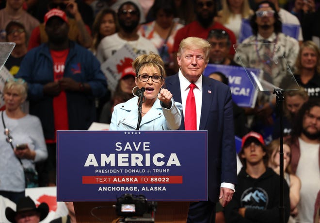 Republican U.S. House  candidate former Alaska Gov. Sarah Palin (L) speaks as former U.S. President Donald Trump (R) looks on during a "Save America" rally at Alaska Airlines Center on July 09, 2022 in Anchorage, Alaska.